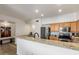 Modern kitchen with granite countertops and stainless steel appliances at 19777 N 76Th St # 2244, Scottsdale, AZ 85255