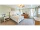 Bright bedroom with a white bed and wooden dresser at 2221 E Frye Rd, Chandler, AZ 85225