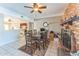 Spacious dining area with brick fireplace and views into the living room at 2221 E Frye Rd, Chandler, AZ 85225