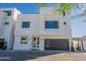 Modern two-story home with sleek design and dark garage door at 2130 E Turney Ave # 4, Phoenix, AZ 85016