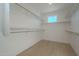 Spacious walk-in closet with ample shelving and hanging space at 2130 E Turney Ave # 4, Phoenix, AZ 85016