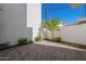 Small backyard patio with brick pavers and small plants at 2130 E Turney Ave # 4, Phoenix, AZ 85016