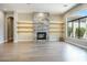 Light-filled living room features a modern fireplace and built-in shelving at 10007 E Ridgerunner Dr, Scottsdale, AZ 85255