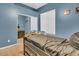 Bedroom with a twin bed and mirrored closet doors at 3514 E Parkview Dr, Gilbert, AZ 85295