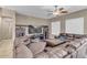 Spacious living room with large sectional sofa and entertainment center at 3514 E Parkview Dr, Gilbert, AZ 85295