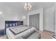 Bright bedroom with gray closet doors and a Fendi headboard at 11312 E Greenway Rd, Scottsdale, AZ 85255