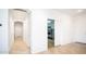 Clean hallway with access to bedrooms and other areas of the home at 7585 W Tumblewood Dr, Peoria, AZ 85382