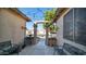 Inviting front entry with benches and string lights, leading to a view of the neighborhood at 7585 W Tumblewood Dr, Peoria, AZ 85382