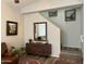 Living room with hardwood floors, staircase and stylish console table at 2416 W Dusty Wren Dr, Phoenix, AZ 85085