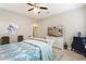 Bright bedroom with a comfortable bed and built-in shelving at 56 E Camellia Way, Queen Creek, AZ 85140