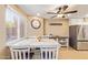 Charming dining area with window seating and white table at 408 E Pecan Rd, Phoenix, AZ 85040