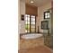 Spa-like bathroom with soaking tub, walk-in shower, and large window at 27440 N Alma School Pkwy # 140, Scottsdale, AZ 85262