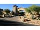 Home with arched entryway and desert landscaping at 27440 N Alma School Pkwy # 140, Scottsdale, AZ 85262