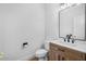 Modern bathroom with floating vanity and designer mirror at 13325 W Luke Ave, Litchfield Park, AZ 85340