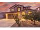 Two-story house with a two-car garage and desert landscaping at 2660 S 172Nd Dr, Goodyear, AZ 85338