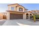 Two-story house with a brown garage door and landscaping at 2660 S 172Nd Dr, Goodyear, AZ 85338