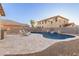 Relaxing pool area with stone patio and water feature at 2660 S 172Nd Dr, Goodyear, AZ 85338