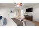 Bright bedroom with a king-size bed, dresser, and ceiling fan at 2660 S 172Nd Dr, Goodyear, AZ 85338