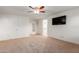 Bright bedroom featuring carpet, ceiling fan, and walk-in closet at 2660 S 172Nd Dr, Goodyear, AZ 85338