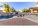 Inviting backyard oasis with a sparkling pool, spacious patio and relaxing lounge chairs at 2660 S 172Nd Dr, Goodyear, AZ 85338