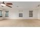 Living room featuring tile floors and multiple windows at 2660 S 172Nd Dr, Goodyear, AZ 85338