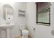 Small bathroom with pedestal sink and toilet at 2660 S 172Nd Dr, Goodyear, AZ 85338
