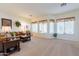 Bright and airy living room with a view of the backyard at 17141 N Oliveto Ave, Maricopa, AZ 85138