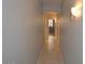 Bright hallway with tile flooring leading to other rooms at 18071 W Douglas Way, Surprise, AZ 85374