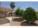 Landscaped backyard with trees and gravel at 18071 W Douglas Way, Surprise, AZ 85374