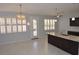 Modern kitchen with granite countertops and island at 18071 W Douglas Way, Surprise, AZ 85374