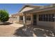Back patio with pergola and gravel landscaping at 18071 W Douglas Way, Surprise, AZ 85374