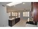Open concept kitchen with island and stainless steel appliances at 18071 W Douglas Way, Surprise, AZ 85374