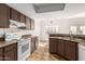 View of kitchen with stove, oven and ample cabinetry at 6705 W Orchid Ln, Peoria, AZ 85345