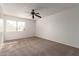 Bright bedroom with carpeted floor and window at 6705 W Orchid Ln, Peoria, AZ 85345