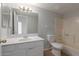 Clean bathroom with white vanity, toilet, and bathtub shower at 6705 W Orchid Ln, Peoria, AZ 85345