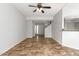 Open living room and kitchen with tile floors at 6705 W Orchid Ln, Peoria, AZ 85345