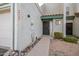 Front entrance with walkway, landscaping, and attached garage at 6705 W Orchid Ln, Peoria, AZ 85345