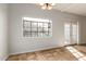 View of dining area with patio doors and large window at 6705 W Orchid Ln, Peoria, AZ 85345