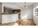 Kitchen features granite countertops and brown cabinets at 6705 W Orchid Ln, Peoria, AZ 85345