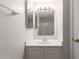 Bright bathroom with vanity, sink, and bathtub at 6705 W Orchid Ln, Peoria, AZ 85345