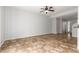 Open concept living room with kitchen and tile floors at 6705 W Orchid Ln, Peoria, AZ 85345