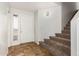 Interior entryway with tiled floors and carpeted stairs at 6705 W Orchid Ln, Peoria, AZ 85345