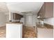Kitchen with granite counters, brown cabinets, and appliances at 6705 W Orchid Ln, Peoria, AZ 85345