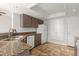 Kitchen boasts granite counters, double sink and dishwasher at 6705 W Orchid Ln, Peoria, AZ 85345