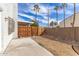 Small backyard with patio and wooden fence at 6705 W Orchid Ln, Peoria, AZ 85345