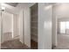 Hallway with linen closet and access to other rooms at 6705 W Orchid Ln, Peoria, AZ 85345
