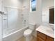 Clean bathroom with a bathtub, toilet, and single sink vanity at 3500 E Cowboy Cove Trl, San Tan Valley, AZ 85143