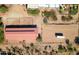 Aerial view of property with barn, arena, and surrounding landscape at 15339 E Red Bird Rd, Scottsdale, AZ 85262