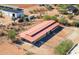 Aerial view showcasing a large barn and surrounding land at 15339 E Red Bird Rd, Scottsdale, AZ 85262