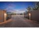 Private gated entrance to a beautiful property with a paved driveway at 15339 E Red Bird Rd, Scottsdale, AZ 85262